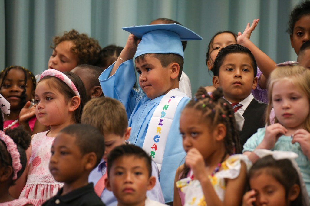 kindergarten, graduation, singing, stage, first year teacher, hug, group photo