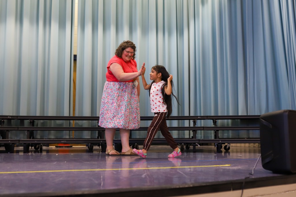 kindergarten, graduation, singing, stage, first year teacher, hug, group photo