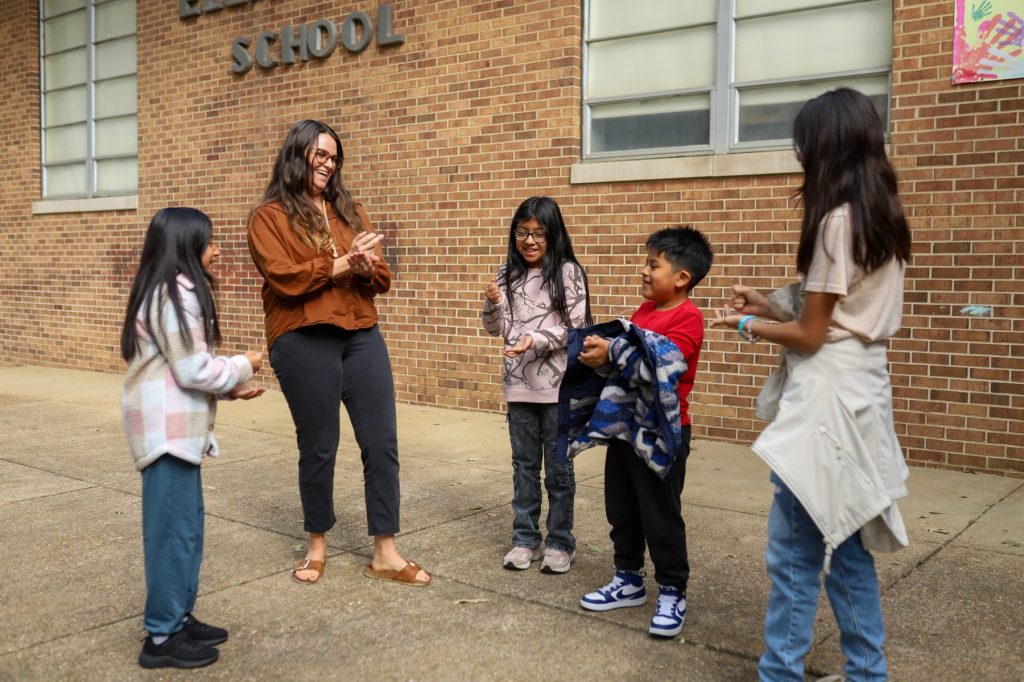 BrewerSocial-06 A teacher plays rock-paper-scissors with students