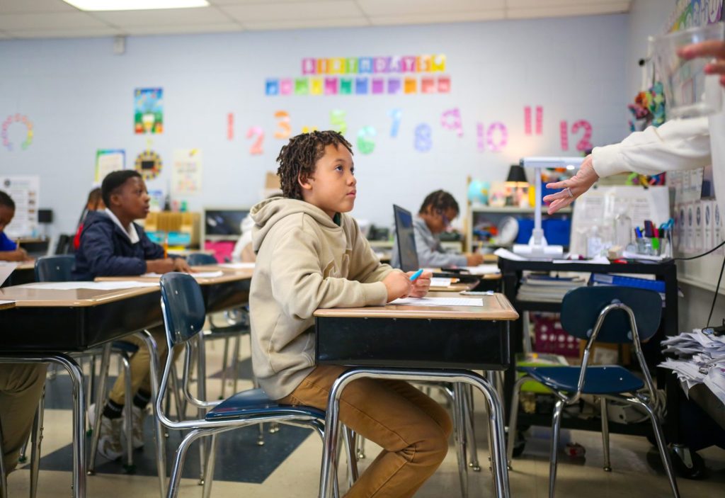 TommieEdit-05 A student listens to a teacher in class