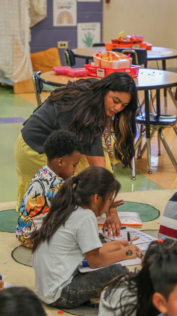 CHE Mentor Highlight-1 teacher with student